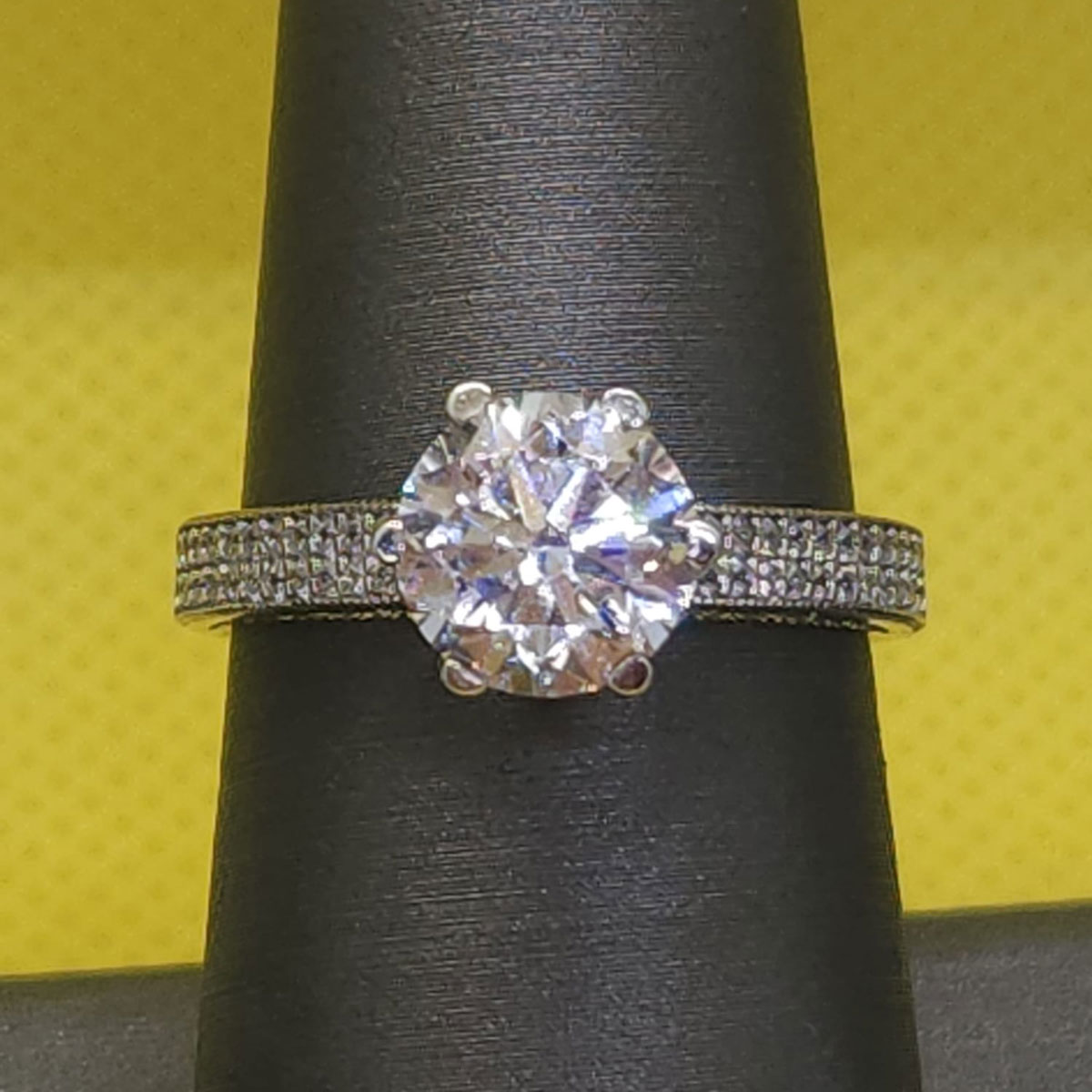 Brilliant-Cut Solitaire Diamond Ring with Pave Band